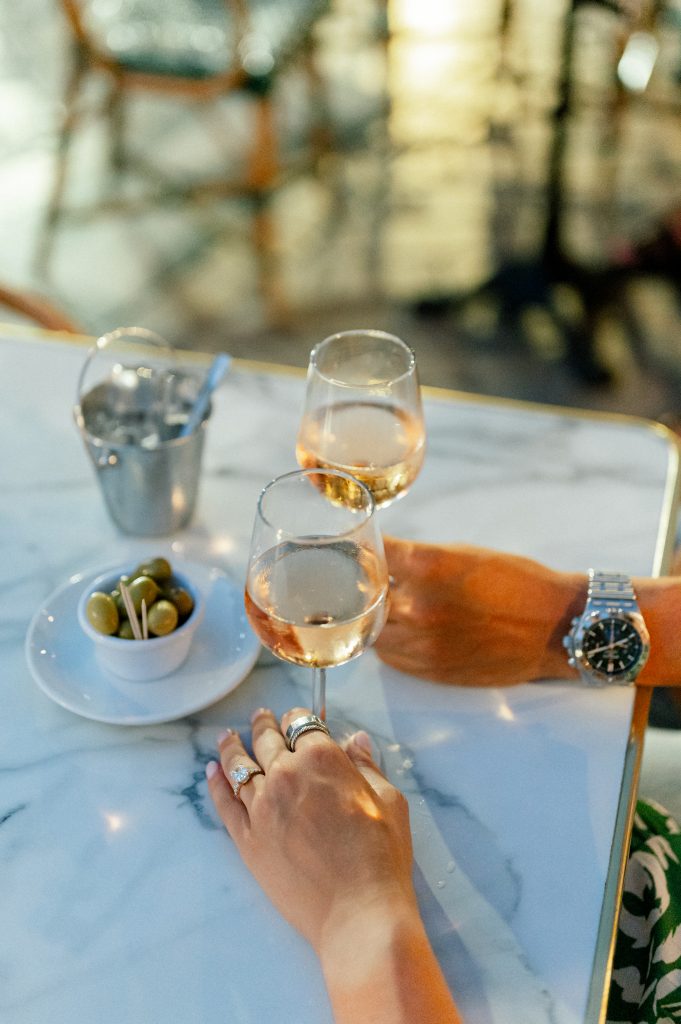 Drinking rosé in provence, south of france after their proposal with sylvia calmet, destination wedding photographer