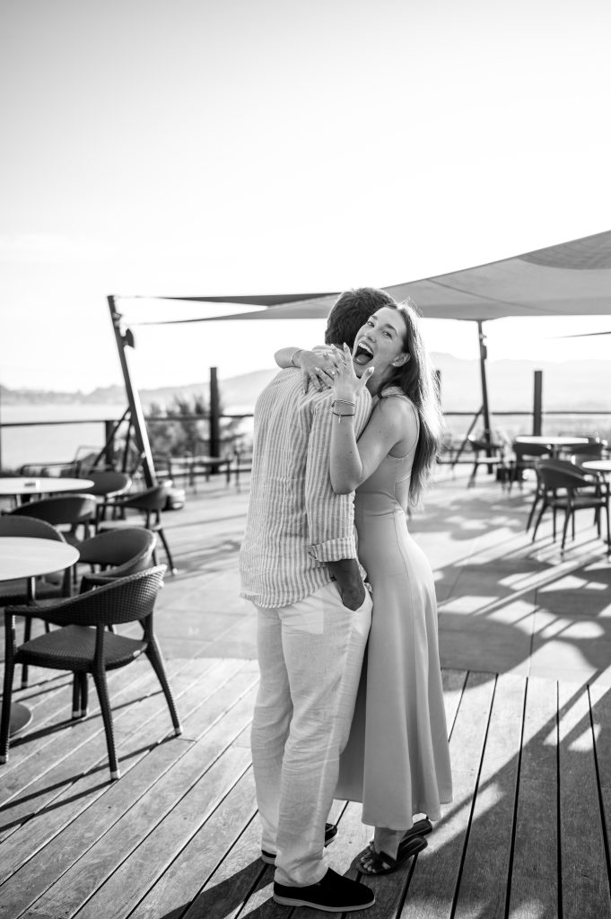 She said yes : black and white picture of a bride saying yes during her surprise proposal