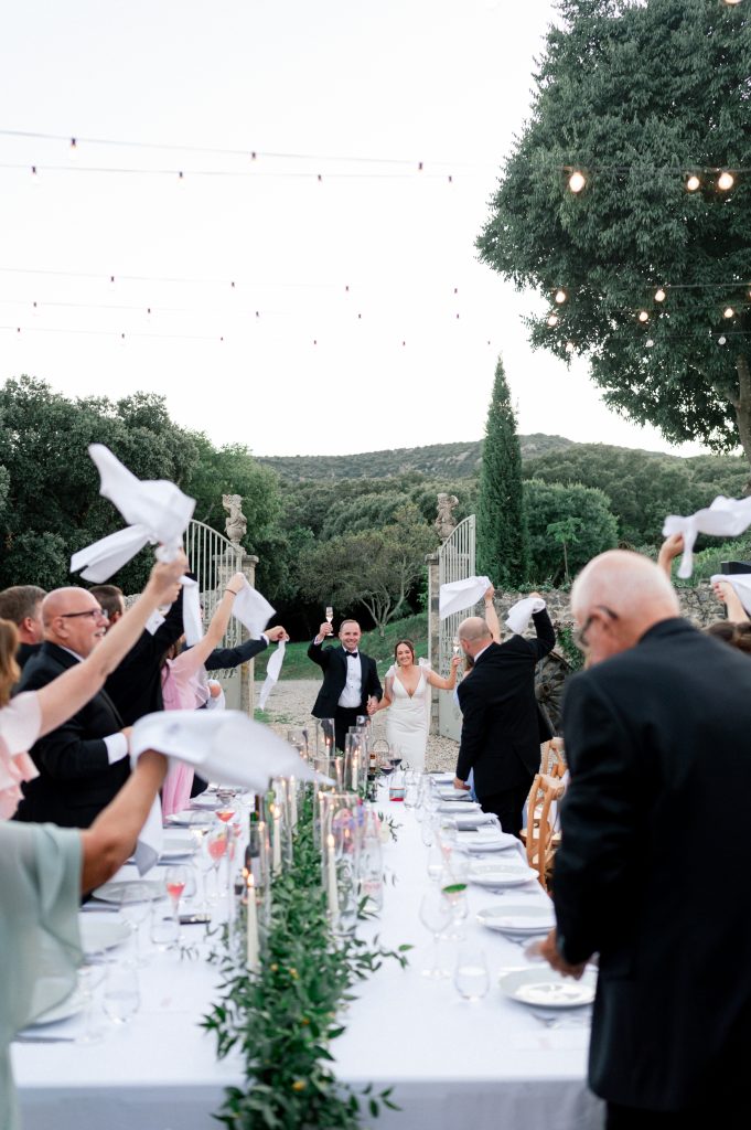 Entrance of the couple for their dinner outside for their intimate wedding at la devèze, gard