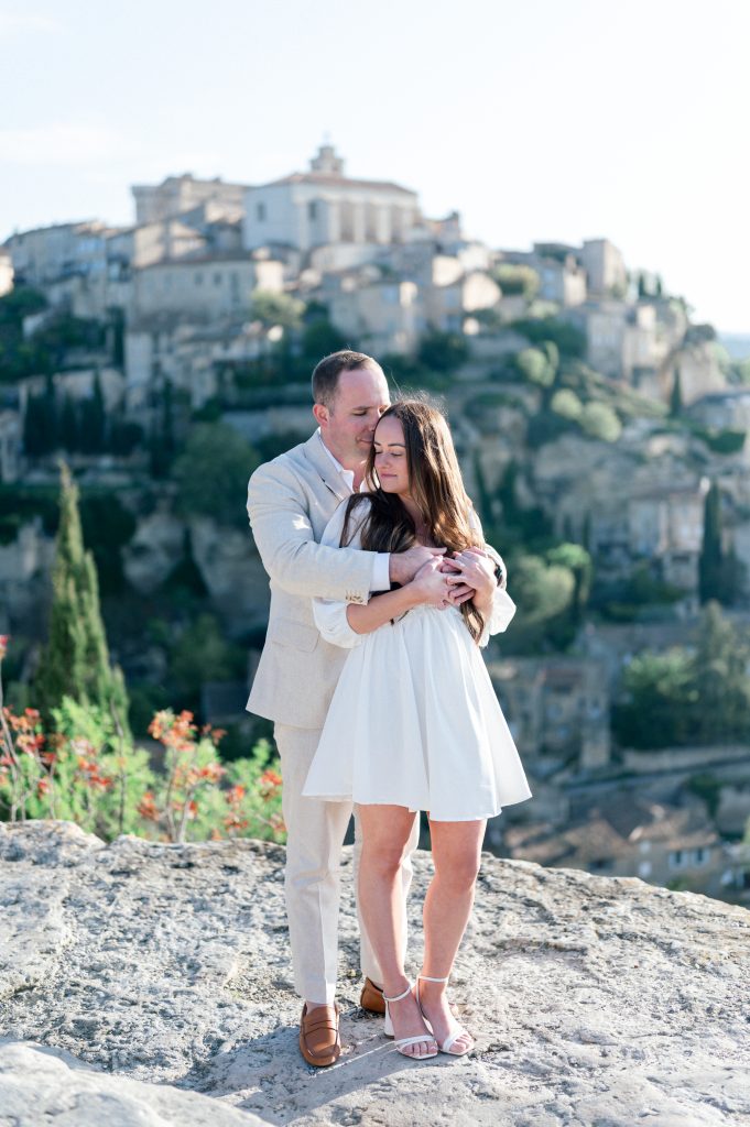 Bride and groom embracing at sunrise in Gordes, Provence