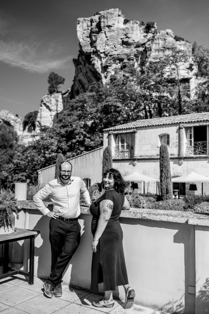 Black and white Portrait of a couple in Les Baux-de-Provence after their surprise proposal