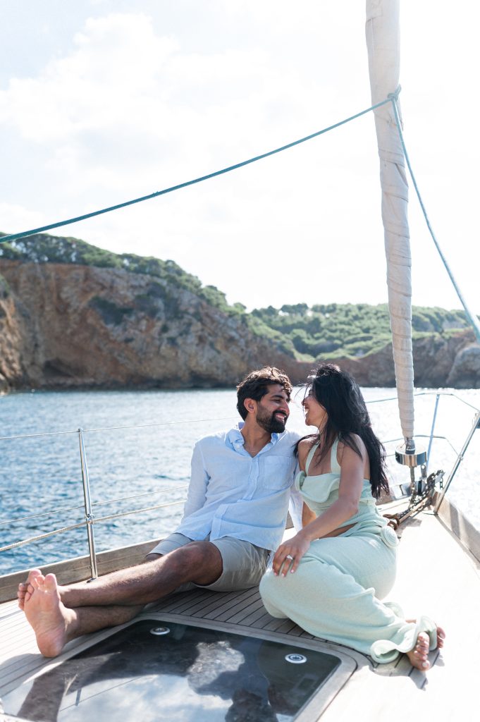 Couple smiling on a boat after the proposal, Marseille coast, Saint cyr sur mer